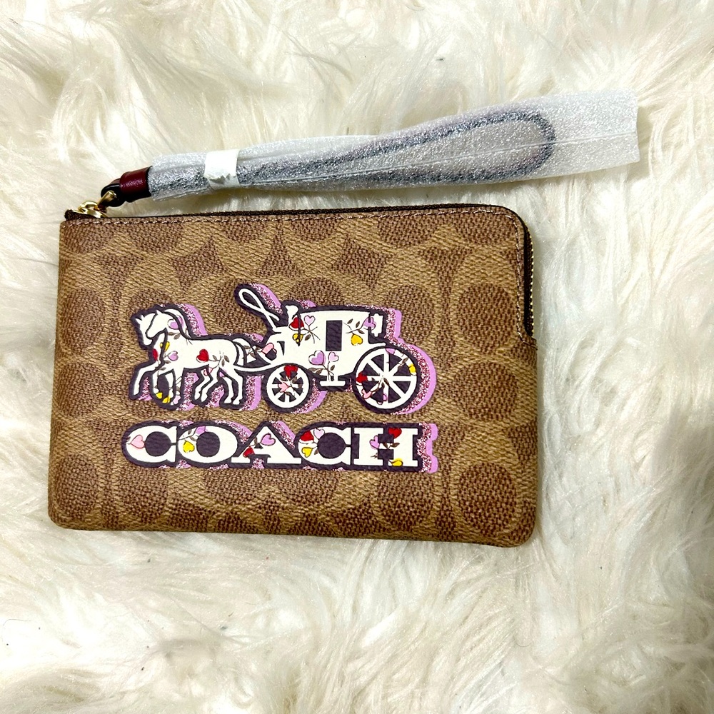 Coach wristlet 6.25” x 4.25” Brown and pink